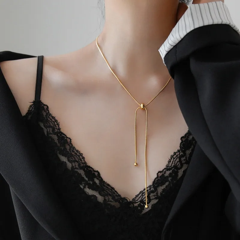 COLLAR CORBATERO CUENTAS REDONDAS