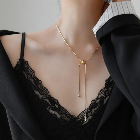 COLLAR CORBATERO CUENTAS REDONDAS